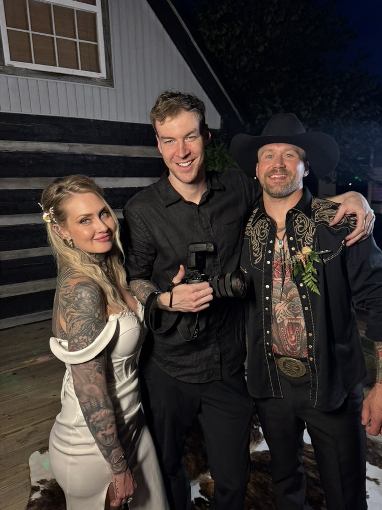 Ben Myers, wedding photographer, with a bride and groom